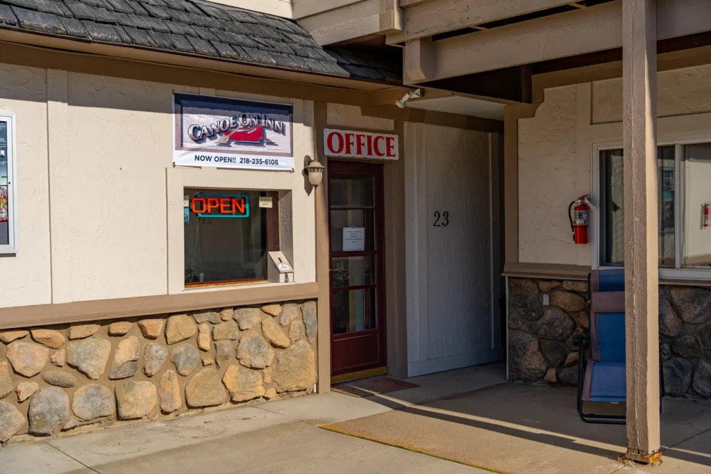 The outside of Canoe on Inn. It has a door leading to the office.