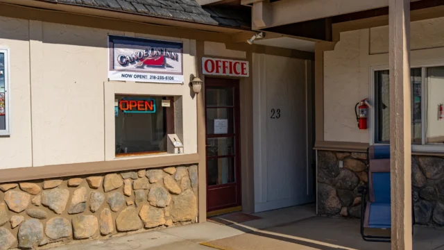 The outside of Canoe on Inn. It has a door leading to the office.