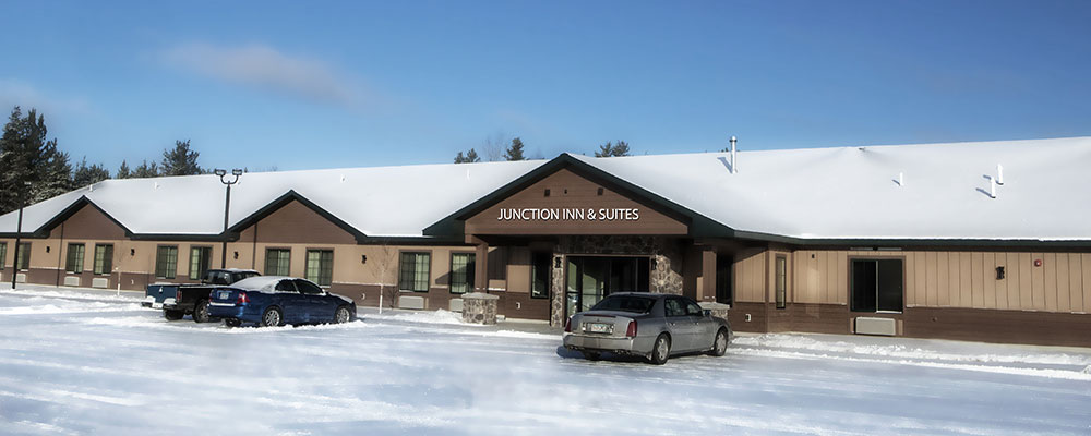 The outside of Junction Inn and Suites during the winter.