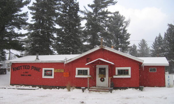 An outside view of the Knotted Pine Inn during the winter.