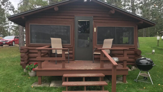 The outside of a cabin at Packsack Log Cabins.