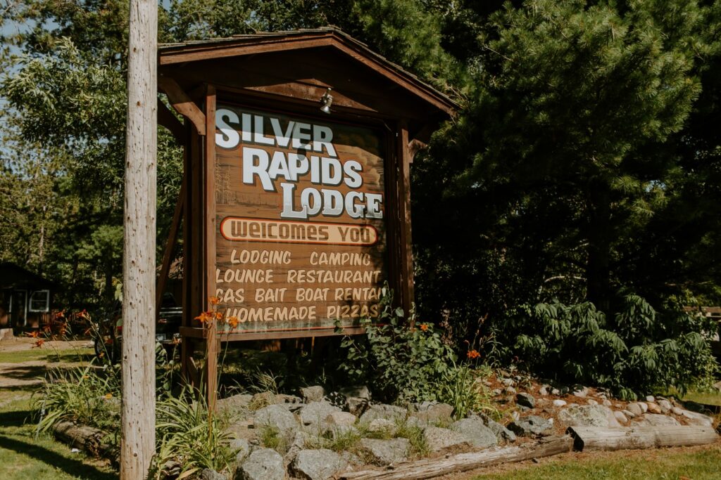 The Welcome sign for the Silver Rapids Lodge.